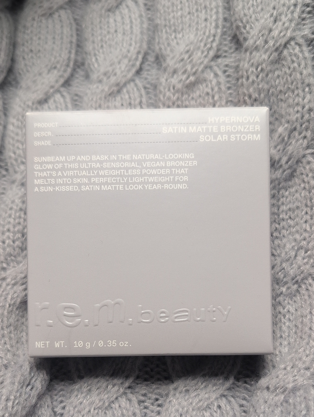 r.e.m. beauty Satin Matte Bronzer - Solar Storm (Gray)
